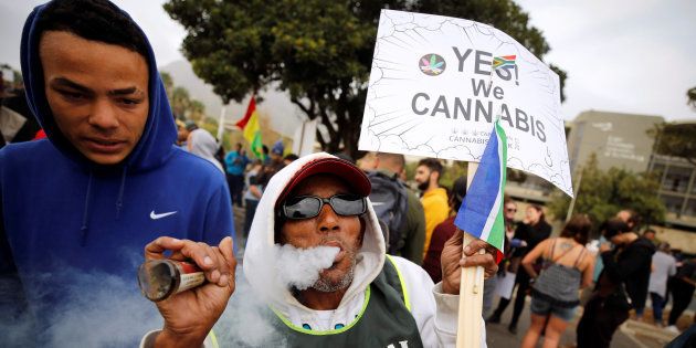 A man smokes marijuana during a march calling for the legalisation of cannabis in Cape Town, South Africa, May 6, 2017.