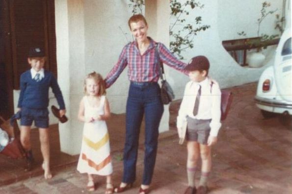 Kimbal, Tosca, and Elon Musk (Right) pose with their mother, Maye, before school in a childhood photo, when the family still lived in South Africa.