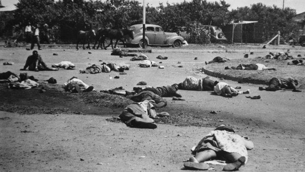 The aftermath of the massacre at Sharpeville, 48km from Johannesburg, in which 69 black South Africans lost their lives. Police opened fire on them during a demonstration against the rule which forces black citizens to carry passes.