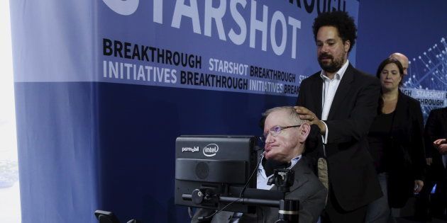 Physicist Stephen Hawking exits the stage during an announcement of the Breakthrough Starshot initiative with investor Yuri Milner in New York April 12, 2016.