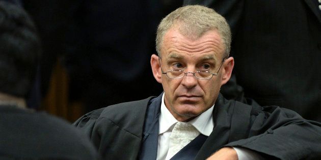 State prosecutor Gerrie Nel attends the second day of the trial of Olympic and Paralympic track star Oscar Pistorius at the North Gauteng High Court in Pretoria March 4, 2014. REUTERS/Antoine de Ras/Pool (SOUTH AFRICA - Tags: SPORT ATHLETICS CRIME LAW)