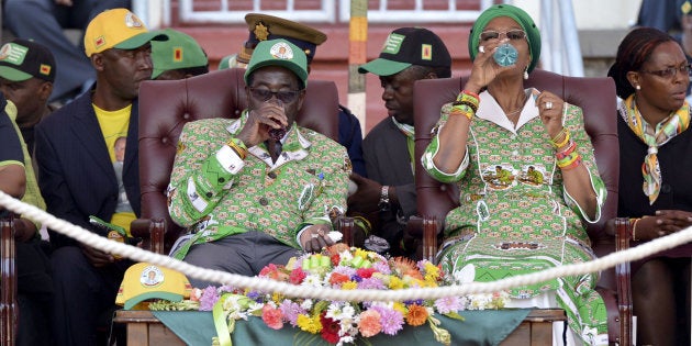 HARARE, ZIMBABWE � JULY 28: President Robert Mugabe and his wife Grace during a ZANU PF rally on July 28, 2013 in Harare, Zimbabwe. The Zimbabwean President held his final campaign rally yesterday and called for unity of his ZANU PF party ahead of the general elections set for July 31. (Photo by Gallo Images / Foto24 / Herman Verwey)