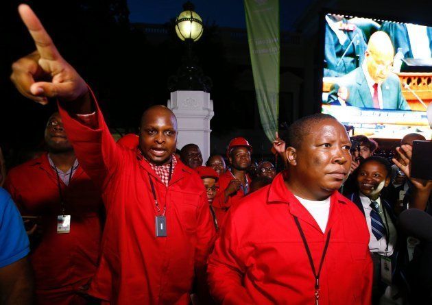 Economic Freedom Fighters (EFF) leaders Floyd Shivambu (L) and Julius Malema (R) leaves parliament after being ordered to do so during President Jacob Zuma's annual State of the Nation Address in Cape Town, February 11, 2016. (Photo credit should read MIKE HUTCHINGS/AFP/Getty Images)