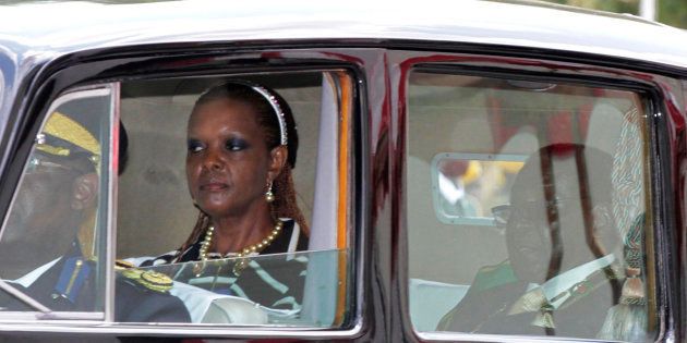 Zimbabwe President Robert Mugabe and his wife Grace arrive at the Parliament in Harare, October 28, 2014.