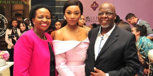 Bonang Matheba poses with her parents Andrew Gampi Matheba and Charlotte during her book launch at Sandton City's Diamond Walk on August 03.