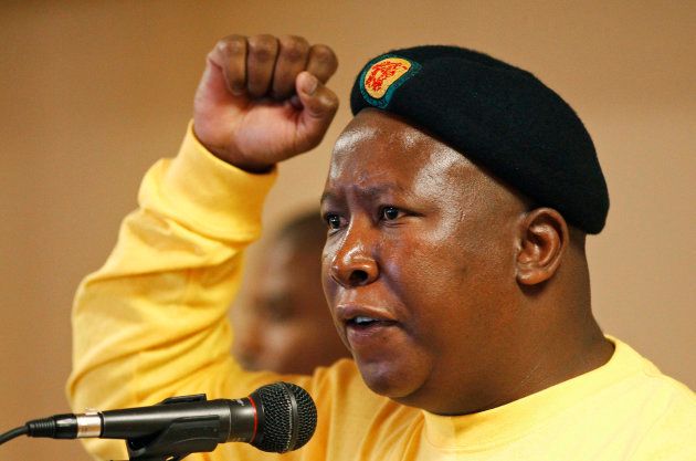 Suspended ANC Youth League President Julius Malema gestures as he sings during the league's three-day annual conference in Pretoria February 10, 2012. REUTERS/Siphiwe Sibeko (SOUTH AFRICA - Tags: POLITICS)