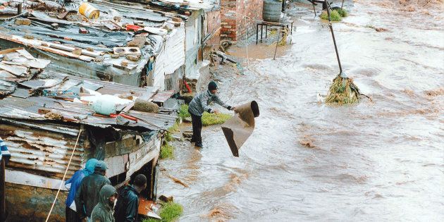 Residents of Alexandra township outside Johannesburg struggle with a burst river bank after torrential rains 8.JN/FMS