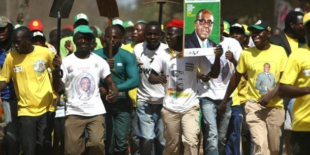 HARARE, ZIMBABWE - AUGUST 3: ZANU PF supporters celebrating on August 4, 2013, in Mbare Township, Zimbabwe. ZANU PF has won the Zimbabwean elections. (Photo by Gallo Images / Sunday Times / Simphiwe Nkwali)