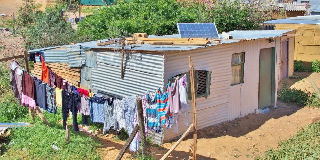 Solar panels on the roof of shack in informal settlement Enkanini, on the outskirts of Stellenbosch in Western Cape.