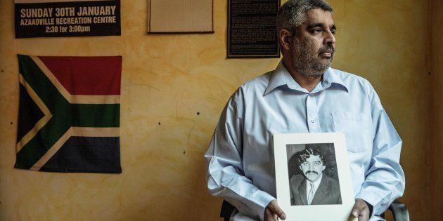 Imtiaz Cajee, the nephew of Ahmed Timol, an anti-apartheid activist brutally murdered in police custody in October 1971, holds a portrait of his uncle at his house on May 25, 2017, in Pretoria.