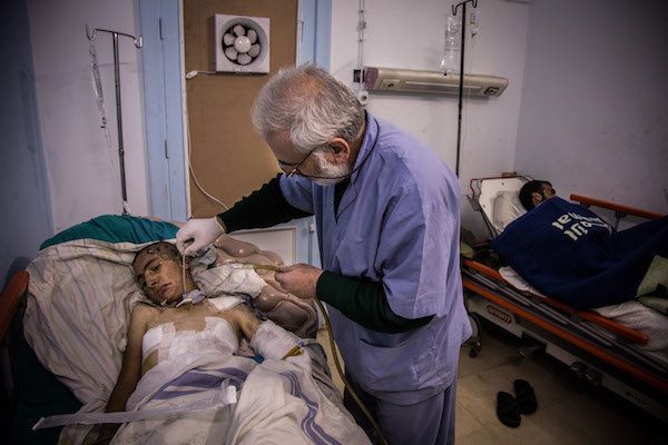 Eleven-year-old Mohamed has shrapnel wounds to his head and body after airstrikes on east Aleppo's Al Maadi neighbourhood in early October 2016. He has been in hospital for four weeks, but cannot be discharged as his wounds need to be drained regularly. Names have been changed.