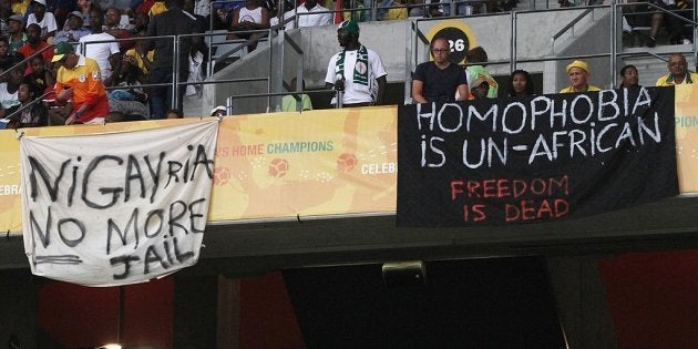 CAPE TOWN, SOUTH AFRICA - JANUARY 19: Banners in protest at the Anti-Gay Marrage Law recently passed in Nigeria are displayed in the crowd during the 2014 African Nations Championship match between South Africa and Nigeria at Cape Town Stadium on January 19, 2014 in Cape Town, South Africa. (Photo by Shaun Roy/Gallo Images/Getty Images)