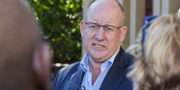 Nelson Mandela Bay mayor Athol Trollip addresses supporters and journalists during a rally outside the mayor's office in Port Elizabeth on April 14, 2016.