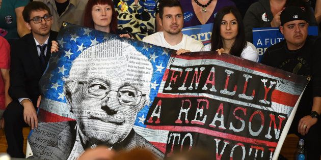 LAS VEGAS, NV - FEBRUARY 14: Supporters hold a poster during a campaign rally by Democratic presidential candidate Sen. Bernie Sanders (D-VT) at Bonanza High School on February 14, 2016 in Las Vegas, Nevada.