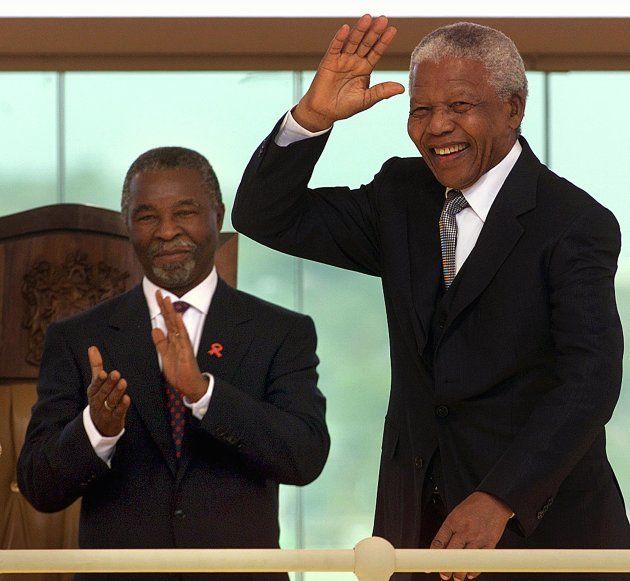 Former South African President Nelson Mandela (R) waves as he arrives for the inauguration of Thabo Mbeki (R) as second democratically elected president of the Republic of South Africa at the Union Buildings. 16 June 1999.