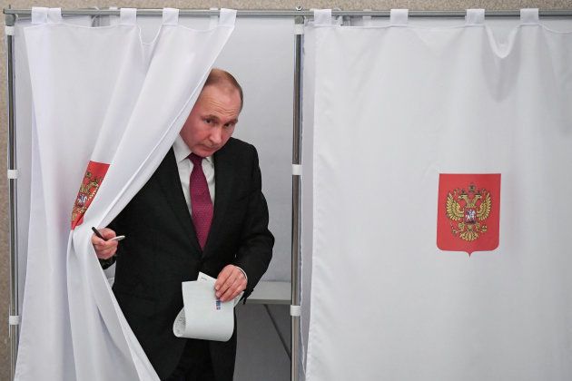 Vladimir Putin at a polling station during the presidential election in Moscow, Russia. March 18, 2018.