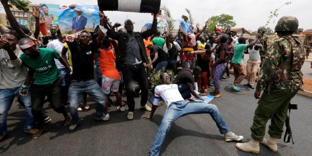 Supporters of an opposition leader Raila Odinga celebrate in Kibera slum after President Uhuru Kenyatta's election win was declared invalid by a court in Nairobi, Kenya, September 1, 2017.
