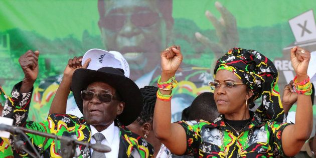 President Robert Mugabe and his wife Grace attend a rally of his ruling ZANU (PF) in Chinhoyi, Zimbabwe, July 29, 2017. REUTERS/Philimon Bulawayo