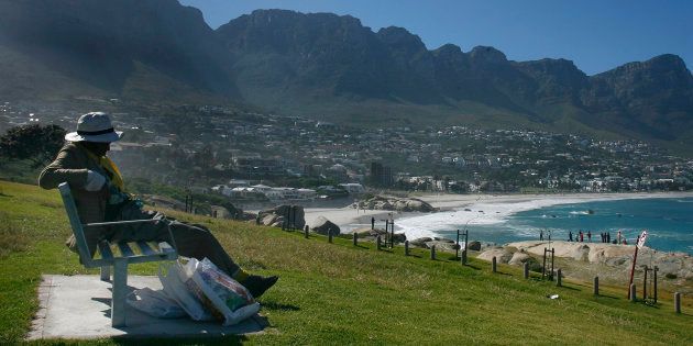 A homeless man sleeps on a bench near the beach in Cape Town December 27, 2007. A DA councillor this week proposed a