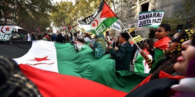 Activists for the independence of the Western Sahara wave flags and banners reading 'Sahara: Only Pace!' during an annual protest organised by the state coordinator of associations of solidarity with the Sahara in Madrid on November 11, 2016 marking the 4th anniversary of the tripartite Madrid agreements demonstrators deem illegal. The Western Sahara is a territory bordered by Morocco and Algeria and disputed by Spain and Morocco who both claiming sovereignty.