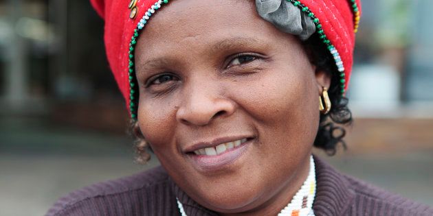 The Iqhiya is the traditional headdress worn by a Xhosa woman. Colloquially known as the doek. The Iqhiya is the main part of the headdress and will either complement the outfit or contrast it. With the iqhiya Xhosa women sometimes wear a Santulo which is made up of different colours and adds volume to the headdress.