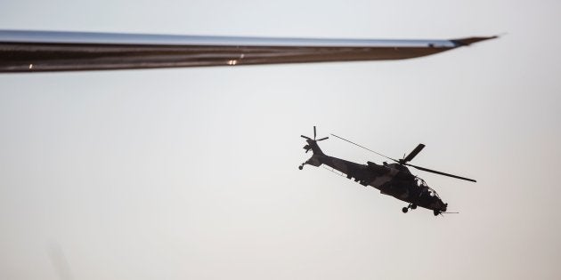 A Denel Rooivalk attack helicopter manifactured by South African Denel flies by during the Africa Aerospace and Defence 2016 fair.