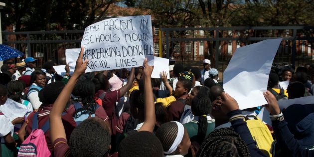 The girls claimed they were not allowed to speak in their mother tongue and that a teacher called them monkeys when they were singing and chanting in class.