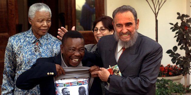 Blade Nzimande, General Secretary of the South African Communist Party, shows his shirt printed with a photo of Cuban leader Fidel Castro and Nelson Mandela, on Sunday, Sept. 2, 2001, in Johannesburg, South Africa.