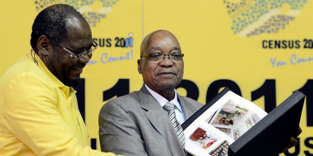 Statistician-General Pali Lehohla (L) poses with President Jacob Zuma.Photo credit should read STEPHANE DE SAKUTIN/AFP/Getty Images