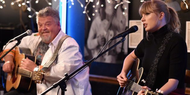 Craig Wiseman and special guest Taylor Swift perform onstage at Bluebird Cafe on March 31, 2018 in Nashville, Tennessee.