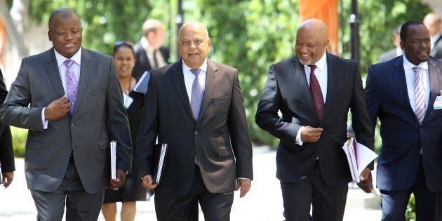 The minister and his men... Minister of Finance Pravin Gordhan (centre) has ordered an inquiry into Sars.