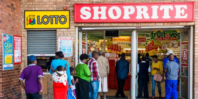 Customers queue to enter a Shoprite supermarket in the Alexandra district of Johannesburg, South Africa.