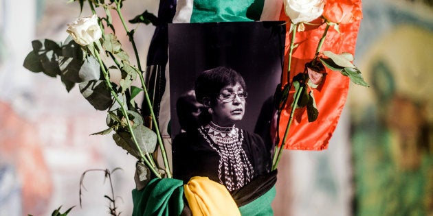 South Africans gather to pay respect to Mam' Winnie during a candle vigil in Durban on April 2, 2018.