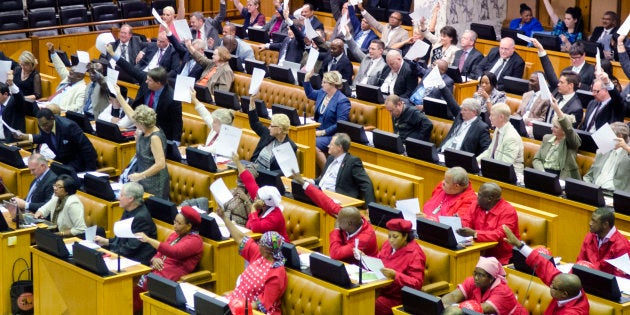 Members of the official opposition Democratic Alliance and members of the Economic Freedom Fighters heckle during parliamentary proceedings on 13 November 2014. The African National Congress described the National Assembly as a