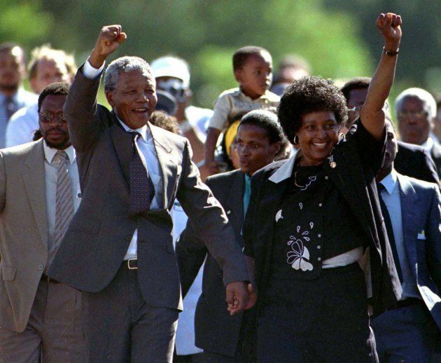 Nelson Mandela, accompanied by Winnie Madikizela-Mandela, walks out of the Victor Verster prison near Cape Town after spending 27 years in apartheid jails in this February 11, 1990 file photo. REUTERS/Ulli Michel/Files