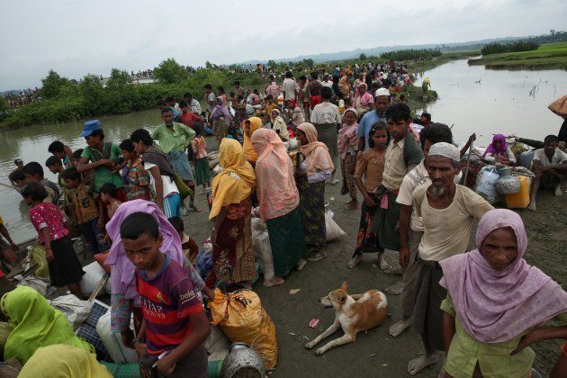 Rohingya people wait to cross the border into Bangladesh by boat across the naf river in Maungdaw, Mayanmar. September 7, 2017. Tens of thousands more people have crossed by boat and on foot into Bangladesh in the last two weeks as they flee violence in western Myanmar.