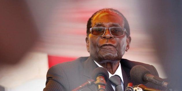 President Robert Mugabe waits to address mourners gathered for the funeral of former cabinet minister and ZANU-PF member Cephas Msipa in Harare, Zimbabwe, October 22, 2016. REUTERS/Philimon Bulawayo