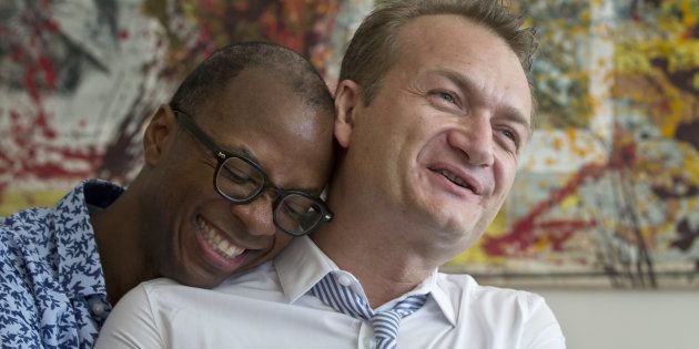 Clay Hamilton, left, and Adrian Coman, a US-Romanian gay couple who got married in Belgium and seek legal recognition of their status in Romania speak during an interview with the Associated Press in Bucharest, Romania, Friday, July 22, 2016. Commentators predict the court, scheduled to rule Tuesday on the marriage of U.S. graphic designer Claibourn Robert Hamilton and Romanian human rights activist Adrian Coman, will vote against the motion, amid opposition from the influential Romanian Orthodox Church and public disapproval of same-sex relationships.