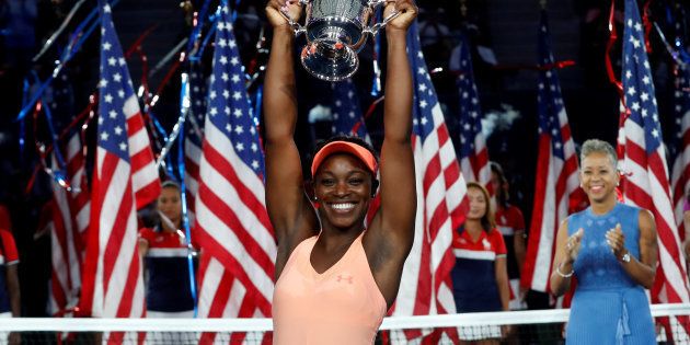 Sloane Stephens of the United States reacts with trophy after defeating Madison Keys of the United States.
