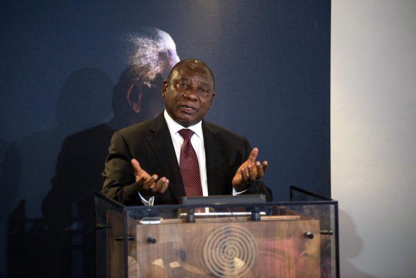 Ramaphosa gestures while speaking at a ceremony commemorating the third anniversary of Nelson Mandela's passing at the Nelson Mandela Foundation in Johannesburg on 05 December 2016. (Photo by Ihsaan Haffejee/Anadolu Agency/Getty Images)