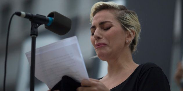 LOS ANGELES, CA - JUNE 13: Singer Lady Gaga tries not to cry while reading some of the names of the dead at a vigil for the worst mass shooing in United States history on June 13, 2016 in Los Angeles, United States. A gunman killed 49 people and wounded 53 others at a gay nightclub in Orlando, Florida early yesterday morning before suspect Omar Mateen also died on-scene. (Photo by David McNew/Getty Images)