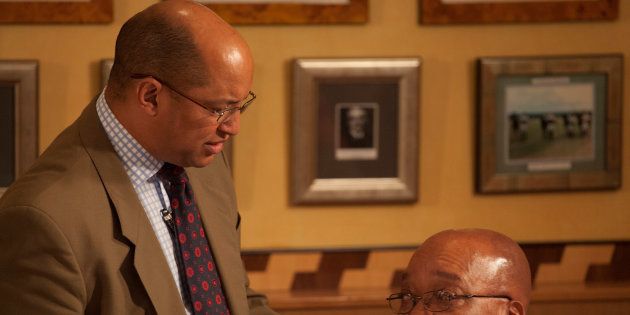 Then ANC president Jacob Zuma speaking to his lawyer, Michael Hulley, ahead of a press conference after appearing at the Durban high court in South Africa on April 7 2009.