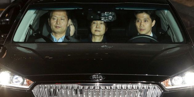 Ousted South Korean president Park Geun-hye (C) leaves the prosecutors' office as she is transferred to a detention house in Seoul, South Korea, on March 31 2017.