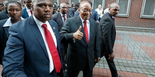 Jacob Zuma gives supporters a thumbs-up as he arrives at the KwaZulu-Natal High Court in Durban on April 6, 2018, to appear for a brief preliminary hearing on corruption charges linked to a multibillion-dollar 1990s arms deal.