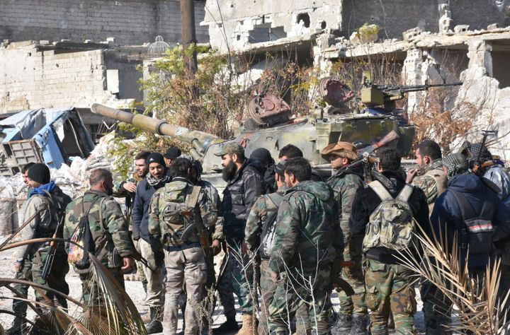 Syrian pro-government forces gather in the Myessar district in east Aleppo as they advance to recapture all of the battered second city, on December 4, 2016.