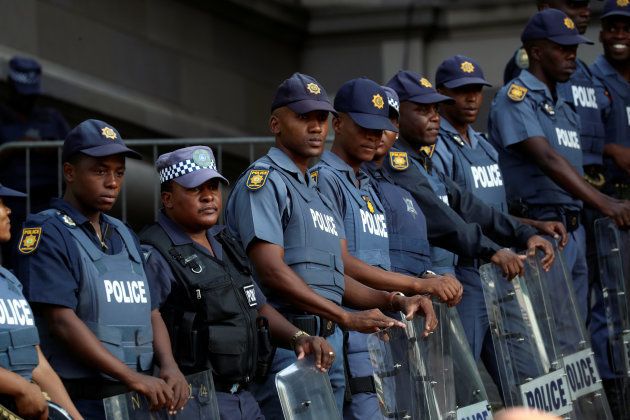 Police stand guard outside the court waiting for the arrival of Jacob Zuma in Durban.