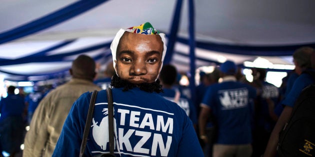 A supporter of South Africa's main opposition Democratic Alliance (DA) party is pictured wearing a mask featuring DA's leader Mmusi Maimane during a party conference on April 7, 2018 in Pretoria. Main opposition Democratic Alliance holds conference amid spat with a former coalition partner and surge in support for ruling African National Congress (ANC). / AFP PHOTO / GULSHAN KHAN (Photo credit should read GULSHAN KHAN/AFP/Getty Images)