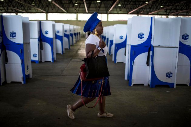 TOPSHOT - A Democratic Alliance (DA) member walks through the voting hall after casting her vote at the federal congress in Pretoria on April 8, 2018. / AFP PHOTO / GULSHAN KHAN (Photo credit should read GULSHAN KHAN/AFP/Getty Images)