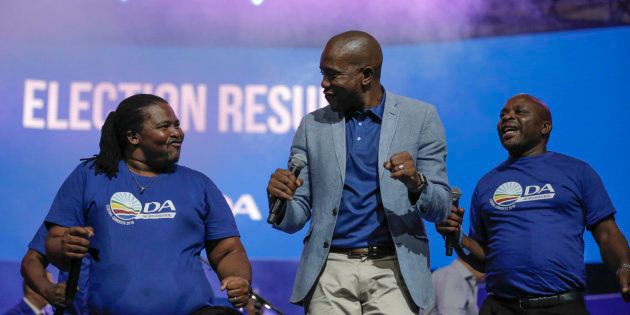 DA leader Mmusi Maimane dances with other party members during the closing of the federal congress in Pretoria on April 8 2018.