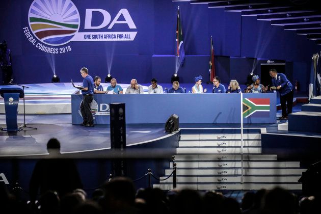 Democratic Alliance (DA) members sit on panel during policy decisions at the federal congress in Pretoria on April 8, 2018. / AFP PHOTO / GULSHAN KHAN (Photo credit should read GULSHAN KHAN/AFP/Getty Images)